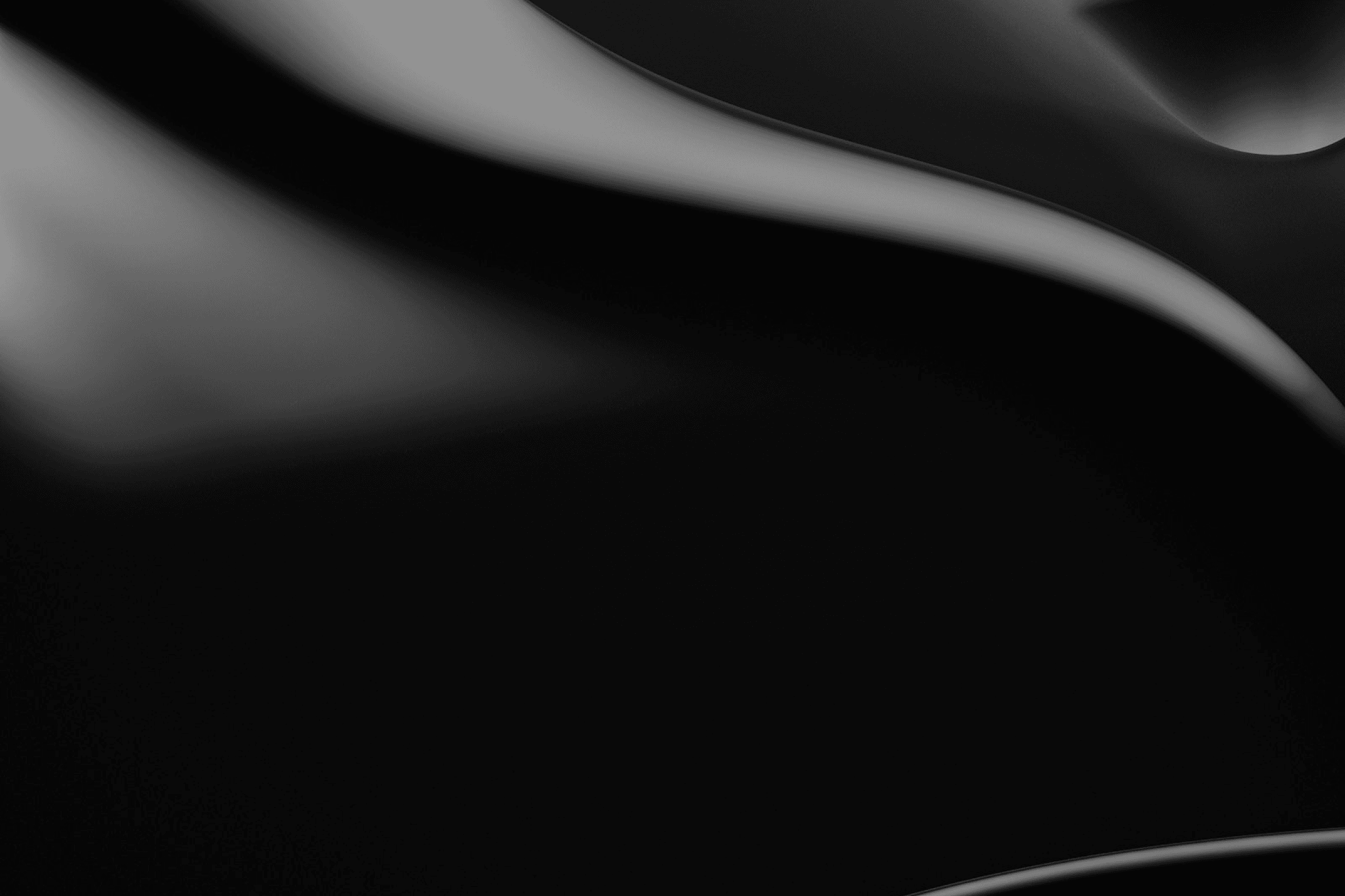 Abstract dark flowing curved surface with soft highlights